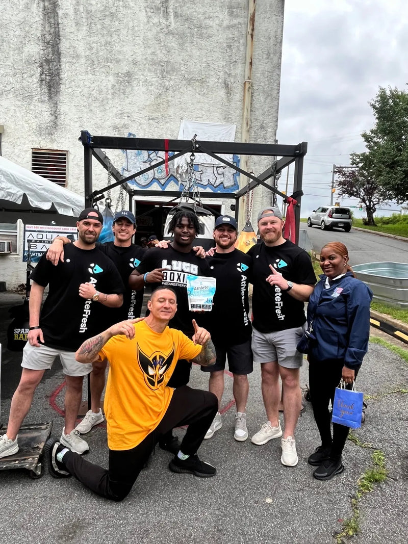 The Athlete Fresh crew in team shirts at a boxing gym event